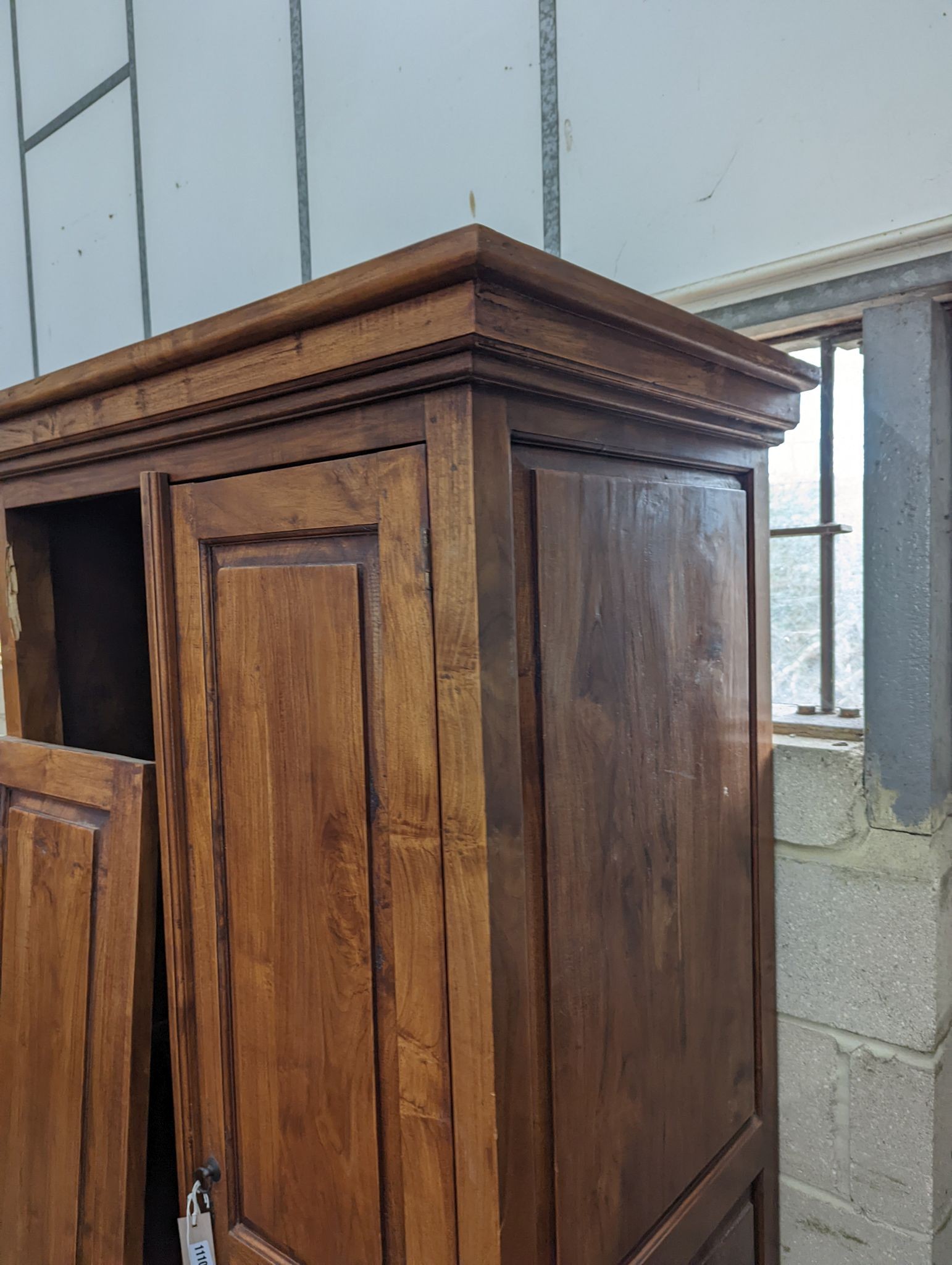 An Indonesian hardwood 2 door wardrobe (damaged), length 100cm, depth 66cm, height 200cm